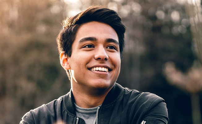 man smiling looking off to the side