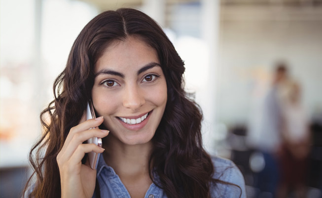 woman on cell phone smiling